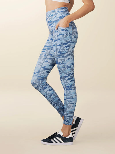 model wears sculpting blue camo pocket leggings