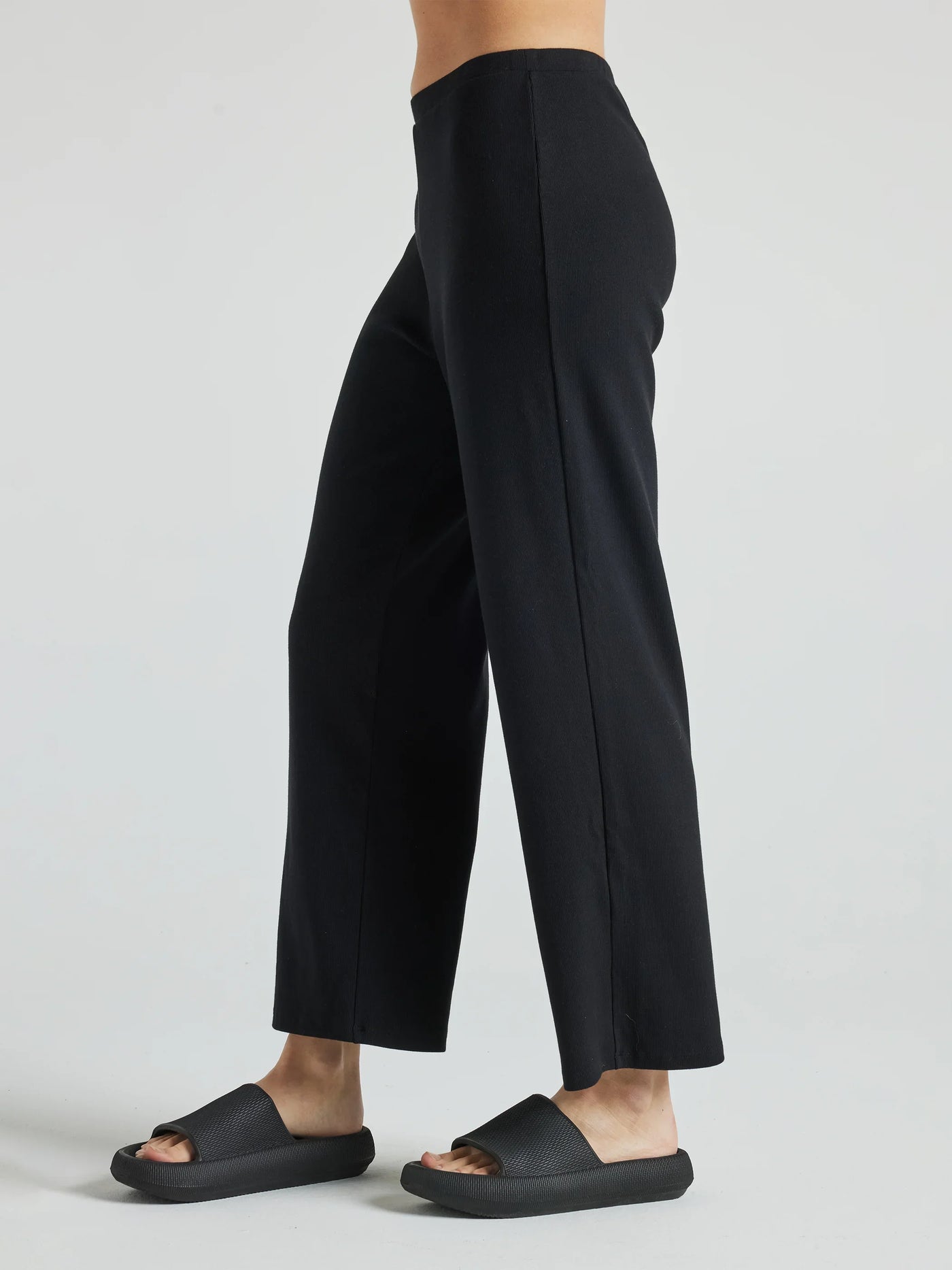 model wears black wide leg relaxed rib cropped pant