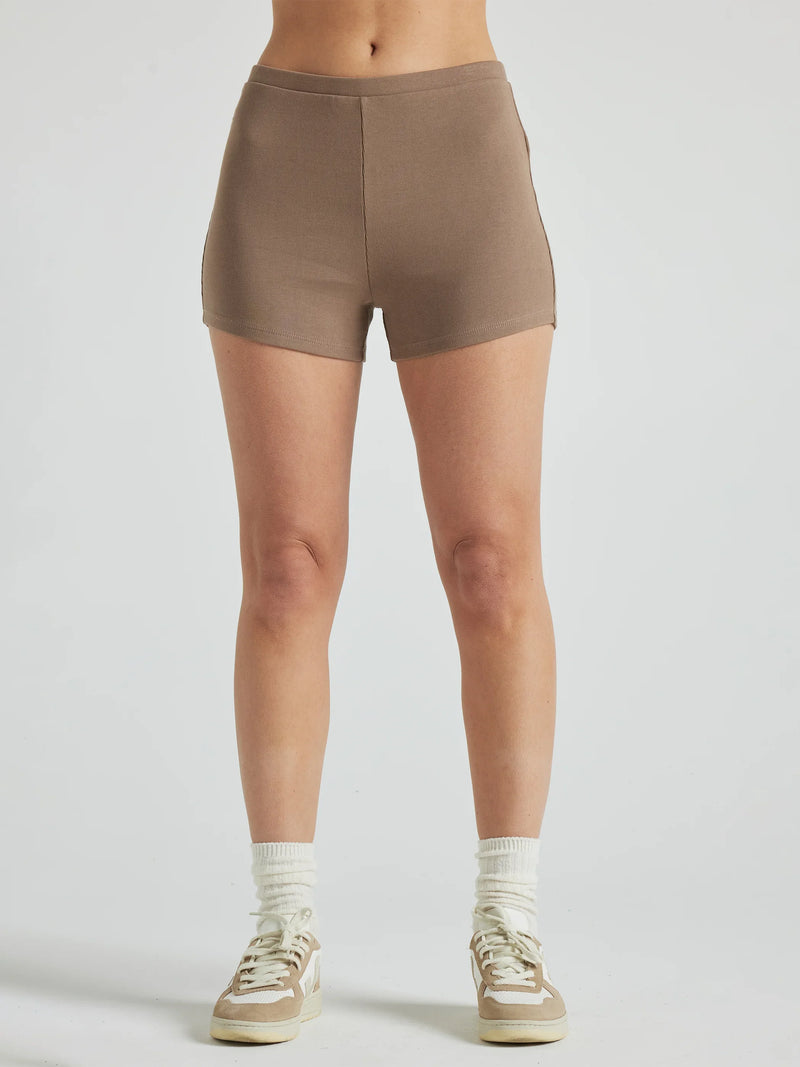 model wears light brown 3 inch inseam rib shorts