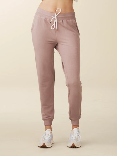 model wears cozy sustainable joggers with pockets in blush