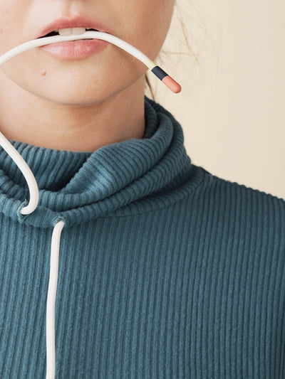 model wears cozy cowl turtleneck rib sweater in teal