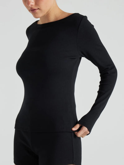 model wears black boat neck long sleeve