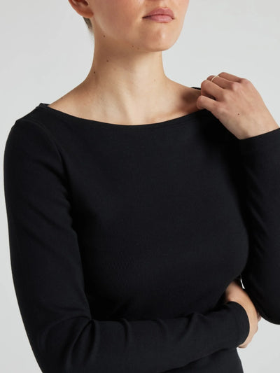 model wears black boat neck long sleeve