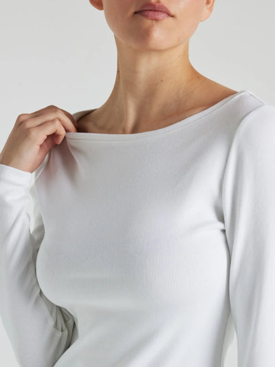 model wears white boat neck long sleeve