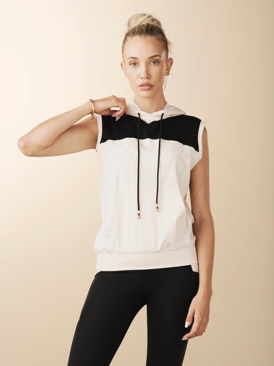 model wears cream colorblock sleeveless hoodie