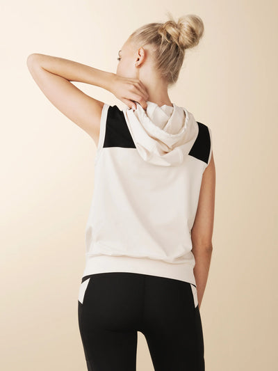 model wears cream colorblock sleeveless hoodie