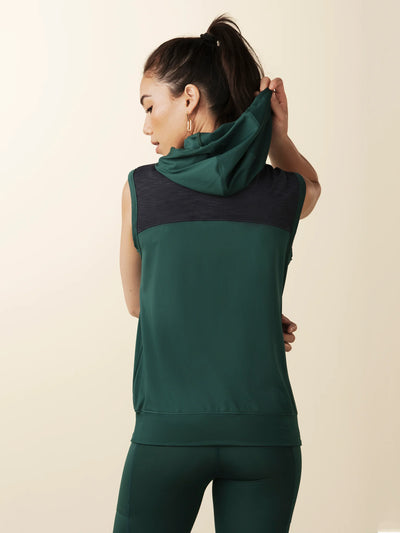 model wears green colorblock sleeveless hoodie